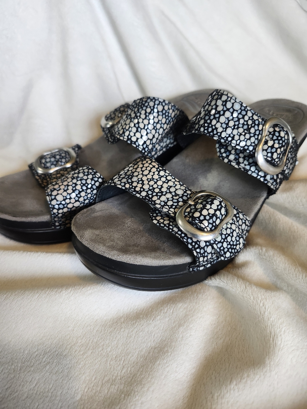 Dansko Black and White Patterned Buckle Clogs